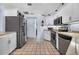 Bright kitchen with stainless steel appliances and white cabinets at 1954 Arkansas Ave, Englewood, FL 34224