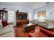 Living room with hardwood floors, neutral walls, and comfy seating at 1954 Arkansas Ave, Englewood, FL 34224