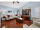 Living room with hardwood floors, neutral walls, and comfy seating at 1954 Arkansas Ave, Englewood, FL 34224