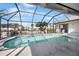 Relaxing screened pool and patio area with canal view at 1954 Arkansas Ave, Englewood, FL 34224