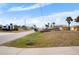 Residential street view with homes and waterway in background at 1954 Arkansas Ave, Englewood, FL 34224