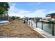 Canal-front property with dock and neighboring houses at 1954 Arkansas Ave, Englewood, FL 34224