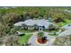 Aerial view of community clubhouse and surrounding landscape at 21228 Sandal Foot Dr, Venice, FL 34293