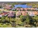 Aerial view of a luxury community with lake access and upscale homes at 21228 Sandal Foot Dr, Venice, FL 34293