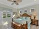 Spacious main bedroom with king-size bed and wood furniture at 21228 Sandal Foot Dr, Venice, FL 34293