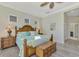 Main bedroom featuring king-size bed, and ensuite bathroom access at 21228 Sandal Foot Dr, Venice, FL 34293