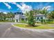 Community clubhouse with stone facade and lush landscaping at 21228 Sandal Foot Dr, Venice, FL 34293