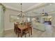 Bright dining room with hardwood floors and view of living room at 21228 Sandal Foot Dr, Venice, FL 34293