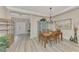 Formal dining area with light-grey walls and wood floors at 21228 Sandal Foot Dr, Venice, FL 34293