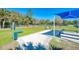 Dog park with fenced area, shaded seating, and waste disposal at 21228 Sandal Foot Dr, Venice, FL 34293