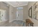 Bright foyer with wood-look floors and a half bath at 21228 Sandal Foot Dr, Venice, FL 34293