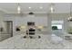 Modern kitchen with white cabinets, granite countertops and island at 21228 Sandal Foot Dr, Venice, FL 34293