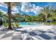 Relaxing freeform pool with lounge chairs and palm trees at 21228 Sandal Foot Dr, Venice, FL 34293