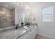 Elegant bathroom with double vanity and frameless shower at 22 Windward Rd, Placida, FL 33946