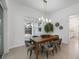 A dining room with wooden table and green chairs, view to backyard at 22 Windward Rd, Placida, FL 33946