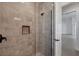 Modern shower with frameless glass enclosure and gray tile at 22 Windward Rd, Placida, FL 33946