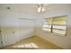 Well-lit bedroom featuring a large window and closet at 22326 Midway Blvd, Port Charlotte, FL 33952