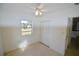 Light-filled bedroom with a ceiling fan and closet, offering a comfortable and functional space at 22326 Midway Blvd, Port Charlotte, FL 33952