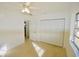 Spacious bedroom with large closet and ceiling fan at 22326 Midway Blvd, Port Charlotte, FL 33952