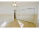 Well-lit bedroom featuring a double door closet and ceiling fan at 22326 Midway Blvd, Port Charlotte, FL 33952