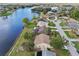 Aerial view showcasing home's location on a lake at 2365 Malaya Ct, Punta Gorda, FL 33983