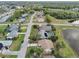 Aerial view of residential neighborhood, featuring a home near a lake at 2365 Malaya Ct, Punta Gorda, FL 33983