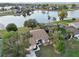 Aerial view of house near lake with lush landscaping at 2365 Malaya Ct, Punta Gorda, FL 33983