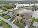 Aerial view of lakefront home and surrounding community at 2365 Malaya Ct, Punta Gorda, FL 33983