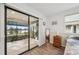 Bedroom with lake view and sliding glass doors at 2365 Malaya Ct, Punta Gorda, FL 33983