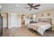 Main bedroom with king bed, en-suite bathroom and sliding doors to patio at 2365 Malaya Ct, Punta Gorda, FL 33983