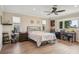 Large main bedroom with a king-size bed and an office area at 2365 Malaya Ct, Punta Gorda, FL 33983