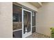 White screened door with an ornate heron design accents the entryway at 2365 Malaya Ct, Punta Gorda, FL 33983