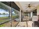 Serene screened porch with lake view and ceiling fan at 2365 Malaya Ct, Punta Gorda, FL 33983