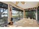 Bright screened porch with lake view and wood flooring at 2365 Malaya Ct, Punta Gorda, FL 33983