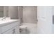 Clean bathroom, featuring a bathtub and white vanity at 2462 Ensenada Ln, North Port, FL 34286