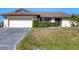 Front view of a single-story home with attached garage at 2483 Dixon Ter, Port Charlotte, FL 33981