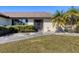 Front view of a single story home with attached garage at 2483 Dixon Ter, Port Charlotte, FL 33981