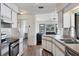 Kitchen features stainless steel appliances and white cabinets at 2483 Dixon Ter, Port Charlotte, FL 33981