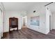 Bright living room with wood-look floors and large window at 2483 Dixon Ter, Port Charlotte, FL 33981