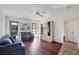 Bright living room with hardwood floors, comfy seating, and built-in shelving at 2483 Dixon Ter, Port Charlotte, FL 33981