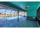 Screened pool area with canal views and lounge seating at 2483 Dixon Ter, Port Charlotte, FL 33981