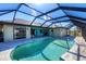 Inviting kidney-shaped pool with a screened enclosure at 2483 Dixon Ter, Port Charlotte, FL 33981