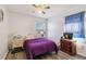 Bedroom with purple bedding, wood floors, and two dressers at 25676 Prada Dr, Punta Gorda, FL 33955