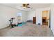 Spacious bedroom with carpeted floor and home gym equipment at 25676 Prada Dr, Punta Gorda, FL 33955