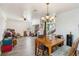 Bright dining area with wood table and chairs, view of living room at 25676 Prada Dr, Punta Gorda, FL 33955