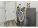 Laundry room with washer and dryer and a door at 25676 Prada Dr, Punta Gorda, FL 33955