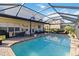 Large screened pool with plenty of patio space for lounging at 25676 Prada Dr, Punta Gorda, FL 33955