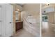 Guest bathroom with granite vanity and tiled floors at 26266 Barcelos Ct, Punta Gorda, FL 33983