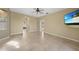 Bright bedroom with ceiling fan and sliding doors to backyard at 26266 Barcelos Ct, Punta Gorda, FL 33983