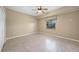 Well-lit bedroom with ceiling fan and window blinds at 26266 Barcelos Ct, Punta Gorda, FL 33983